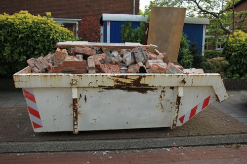 Skip Hire Neasden service truck unloading a skip