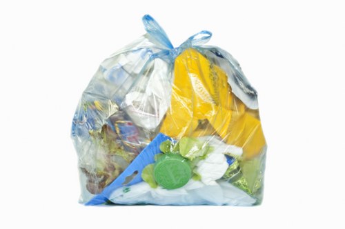 Skip hire vehicle and recyclable materials in Neasden depot