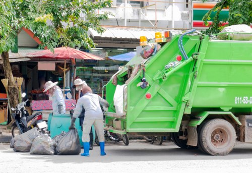 Skip hire vehicle and safety cones